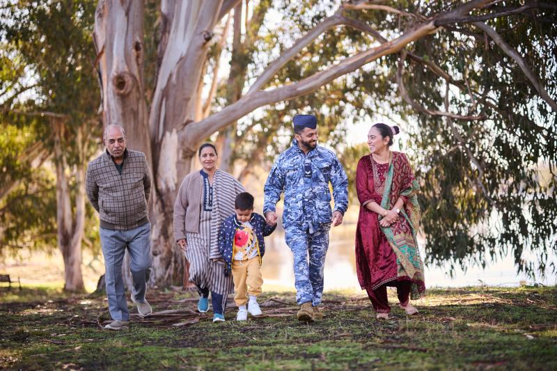 ADF family including extended family enjoying time together outside