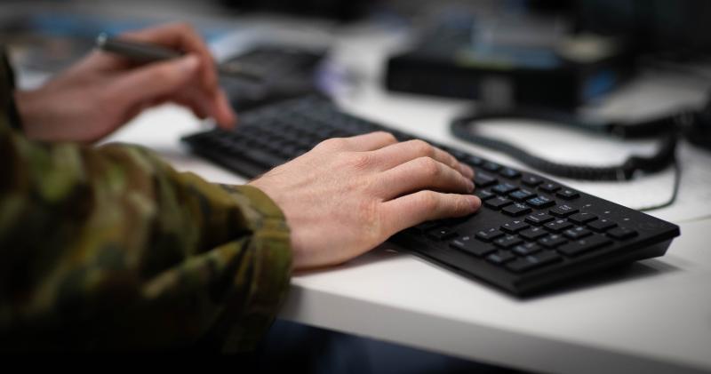 ADF member typing on a keyboard at desk